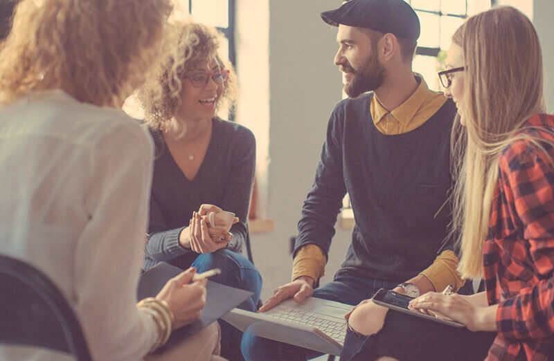 guy-stuff-counceling-coaching-community-group-of-people-discussing-image.jpg
