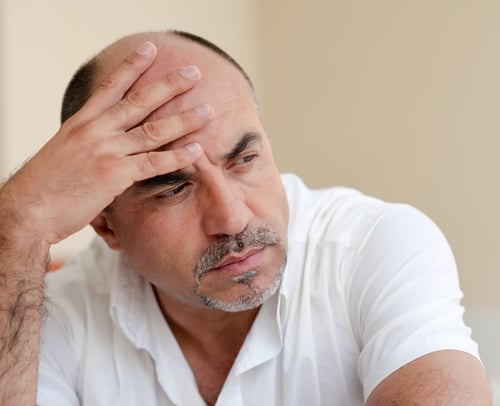 man-struggles-with-midlife-crisis