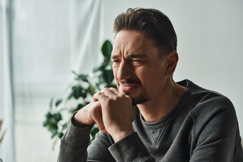 man-wondering-how-to-stop-overthinking-in-his-relationship