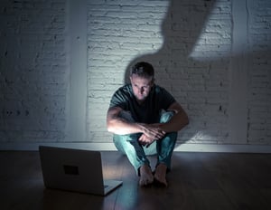 person-dealing-with-digital-abuse-in-his-relationship