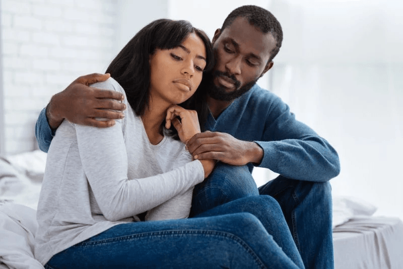 couple comforting eachother